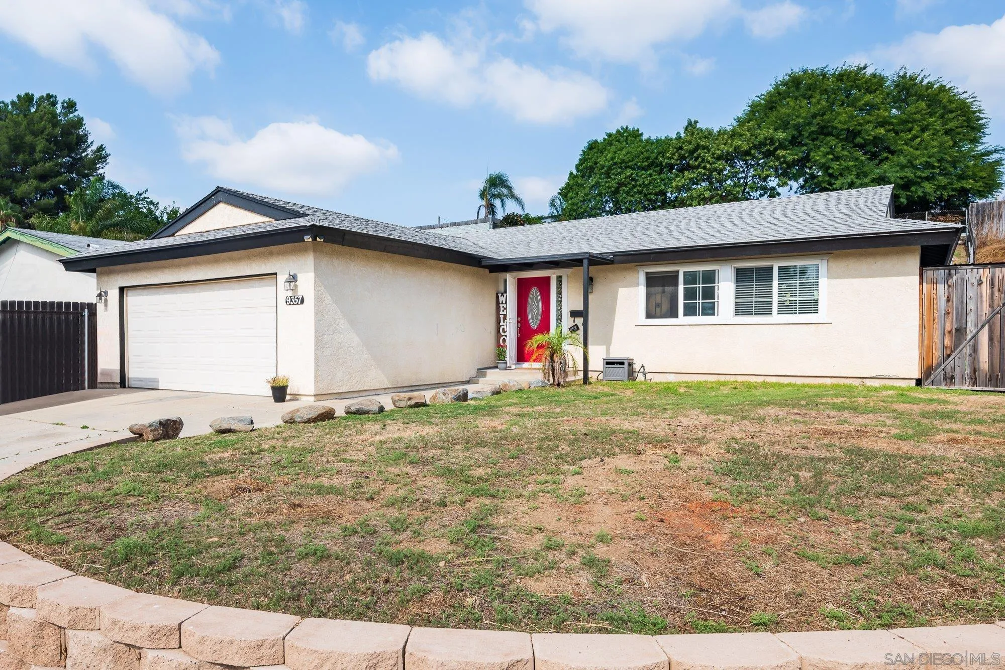 a house view with a backyard space