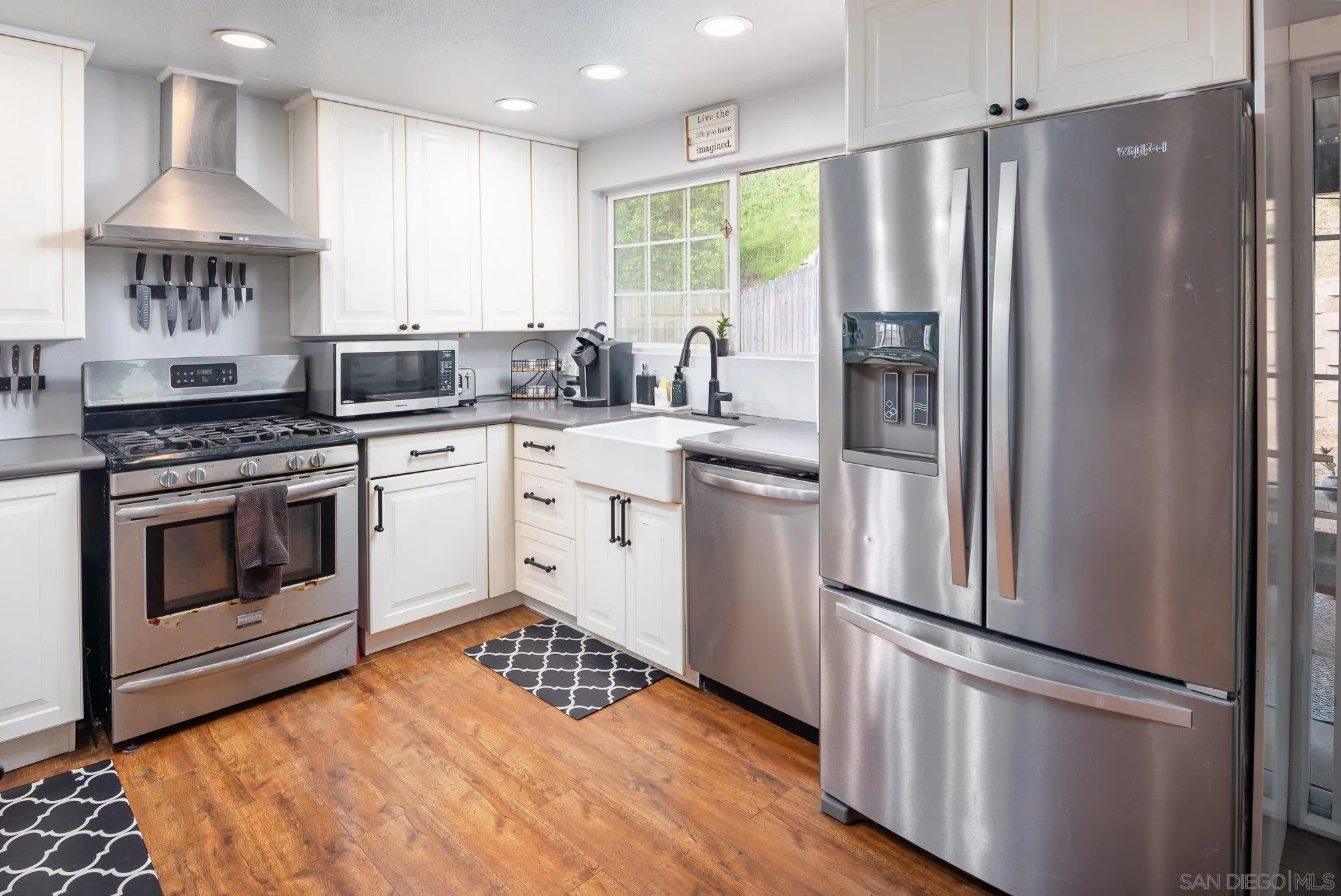 9357 Dempster Drive Santee, CA 92071 - Photo 14 of 35 a kitchen with stainless steel appliances granite countertop a stove a refrigerator and a refrigerator
