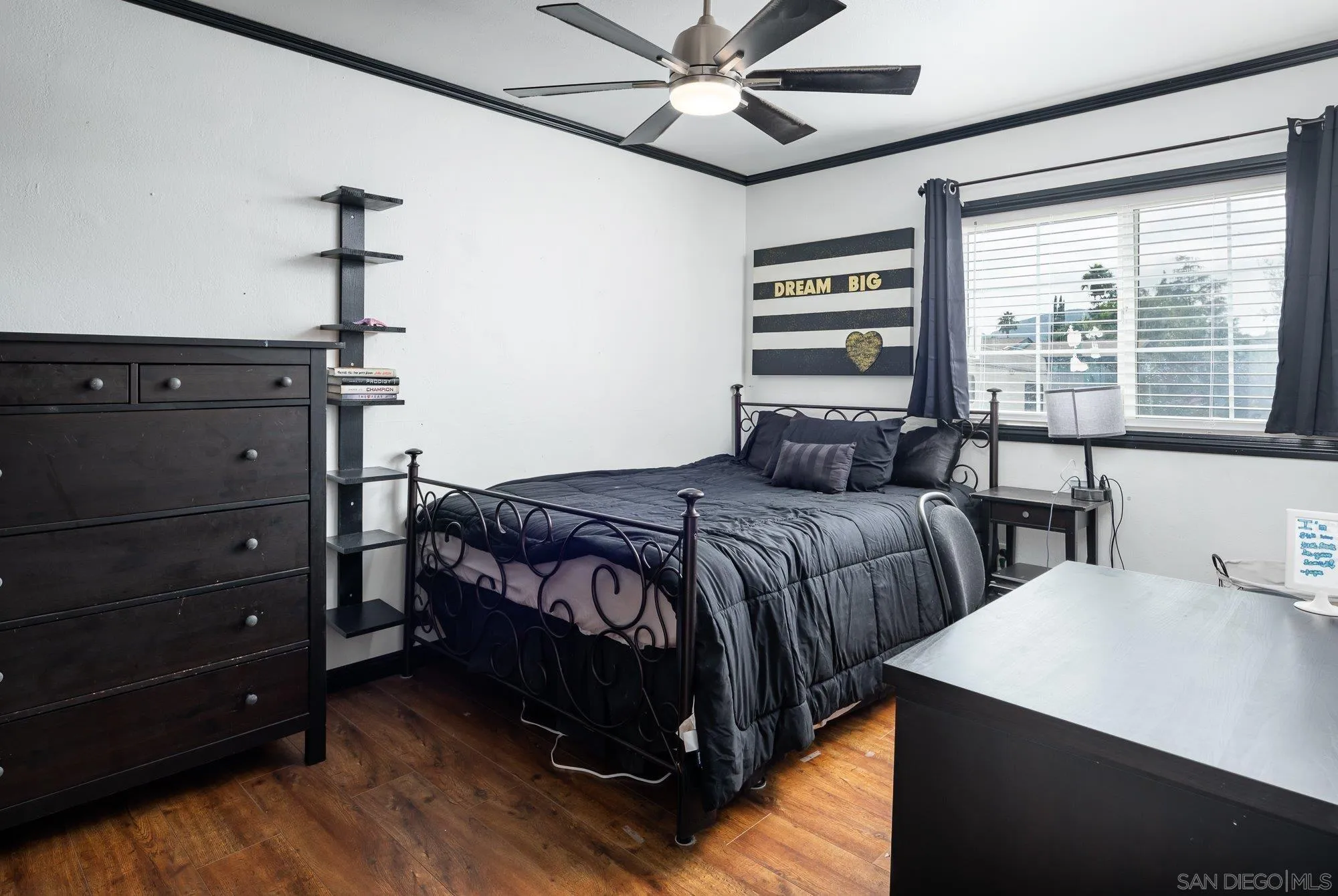 9357 Dempster Drive Santee, CA 92071 - Photo 16 of 35 a bedroom with a bed and a chandelier