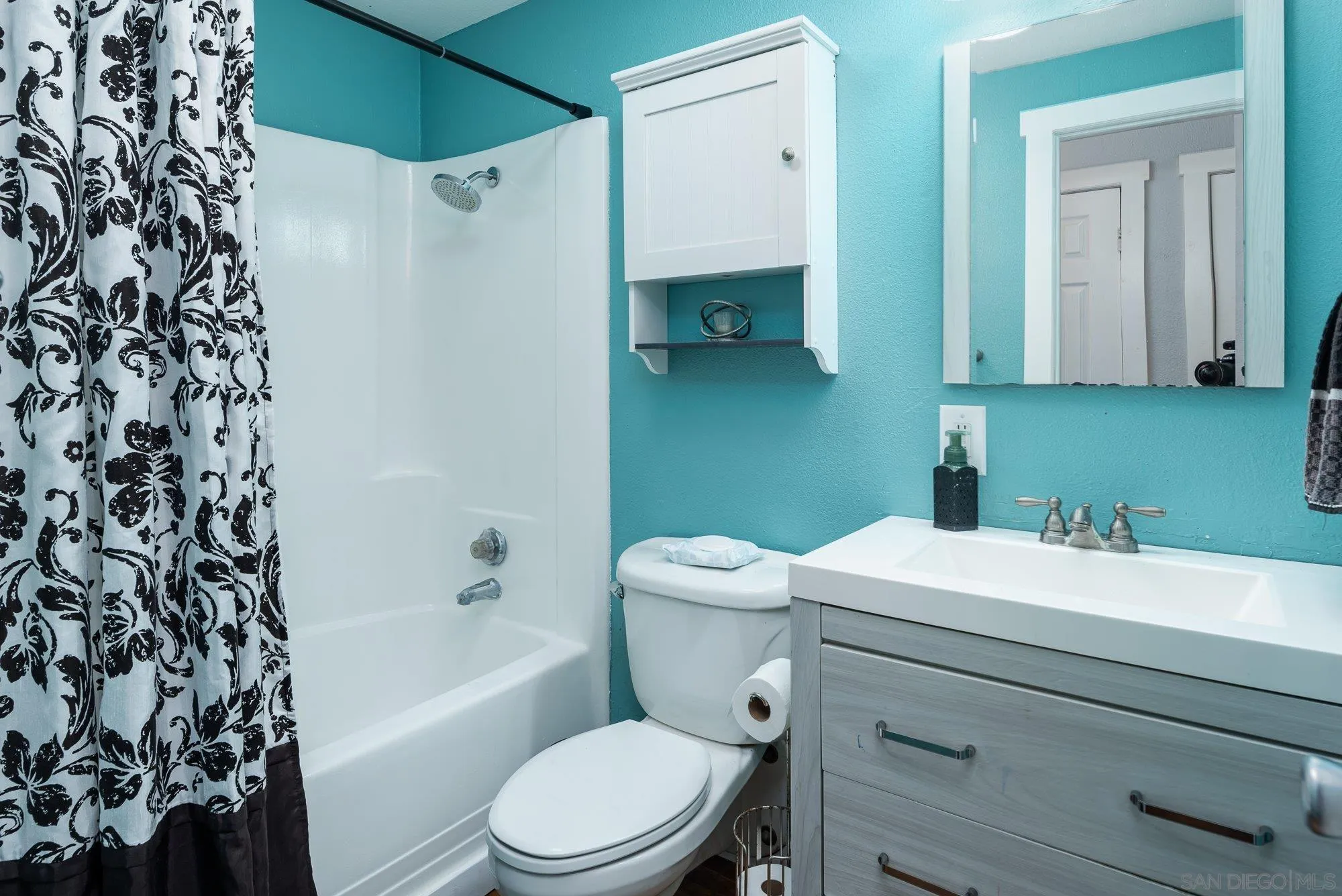 9357 Dempster Drive Santee, CA 92071 - Photo 19 of 35 a bathroom with a sink a toilet and shower