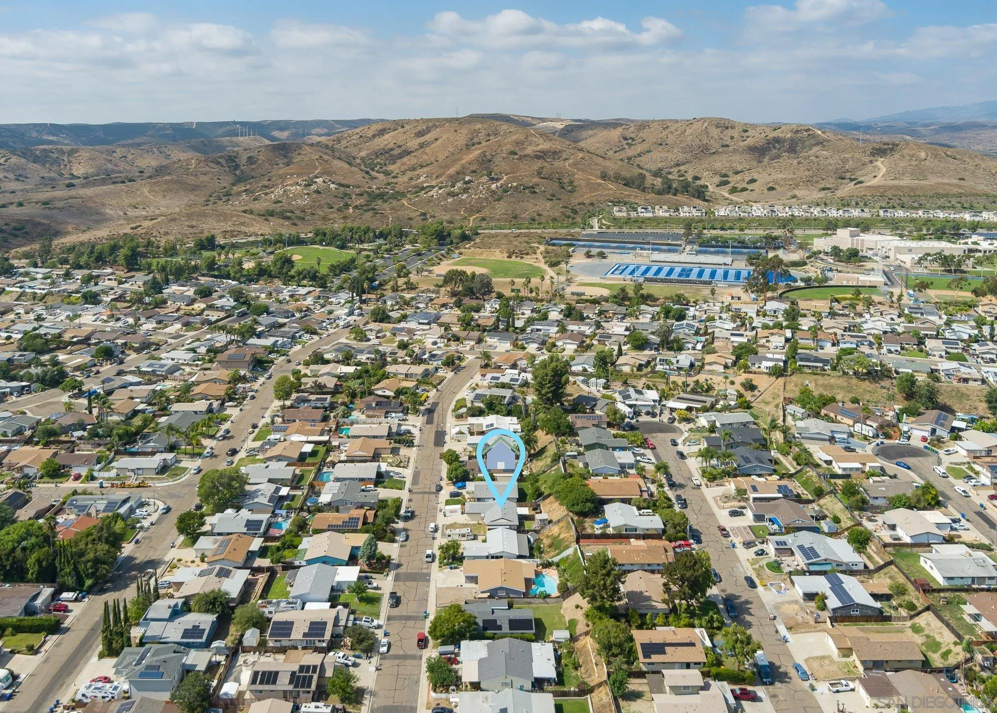 9357 Dempster Drive Santee, CA 92071 - Photo 2 of 35 an aerial view of residential building and parking space