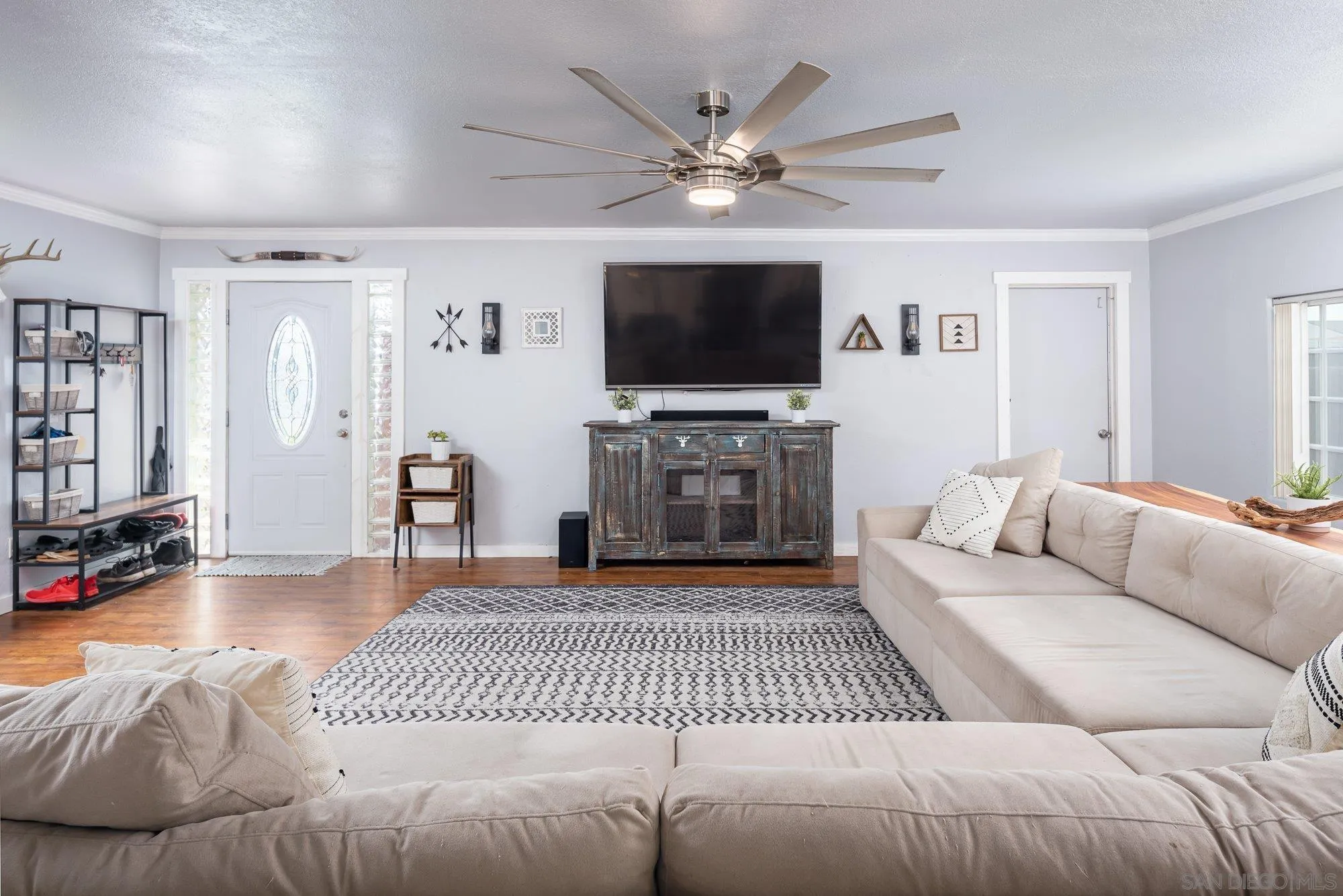 9357 Dempster Drive Santee, CA 92071 - Photo 9 of 35 a living room with furniture and a flat screen tv