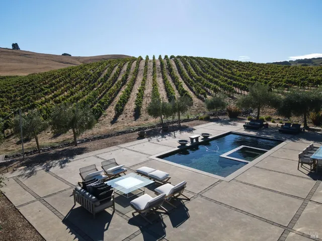 a bathroom with a sink mirror and vanity