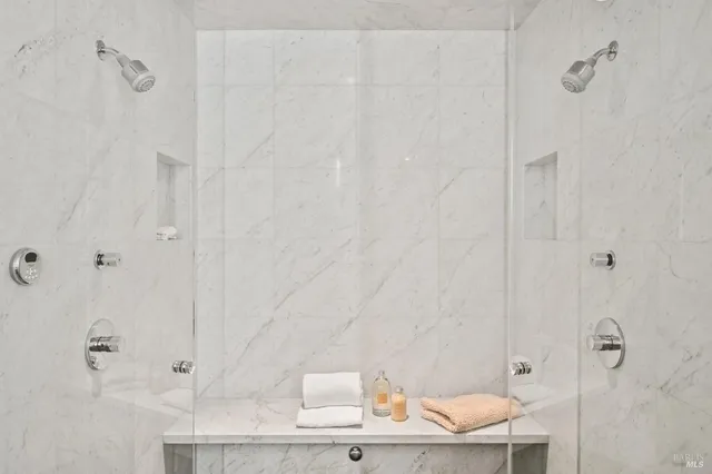 a kitchen with stainless steel appliances granite countertop a sink a stove top oven a counter space and cabinets