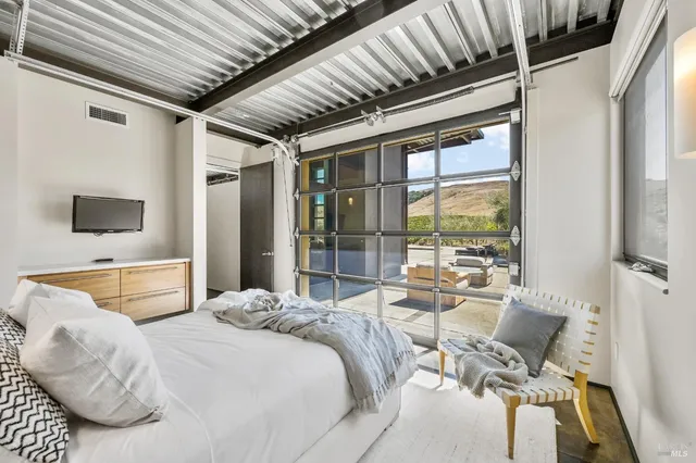 a view of a yard with cars