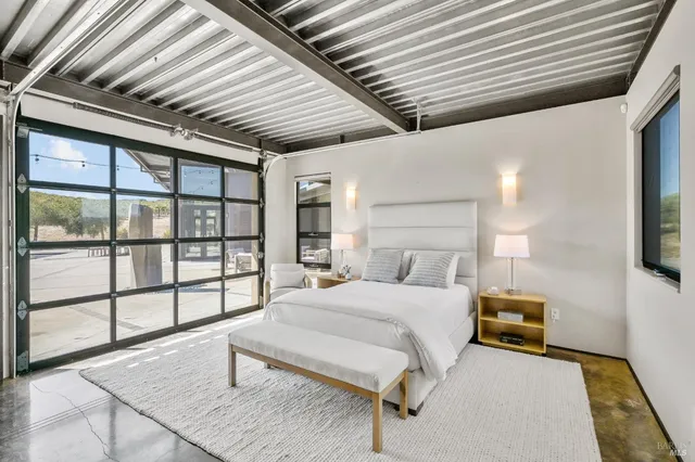 a view of swimming pool with outdoor seating and city view