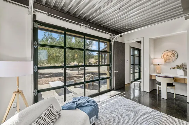 a view of an chairs and table in the balcony