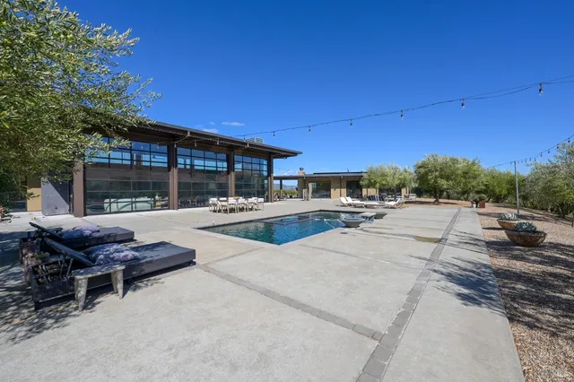 a kitchen with kitchen island a counter space a sink and appliances