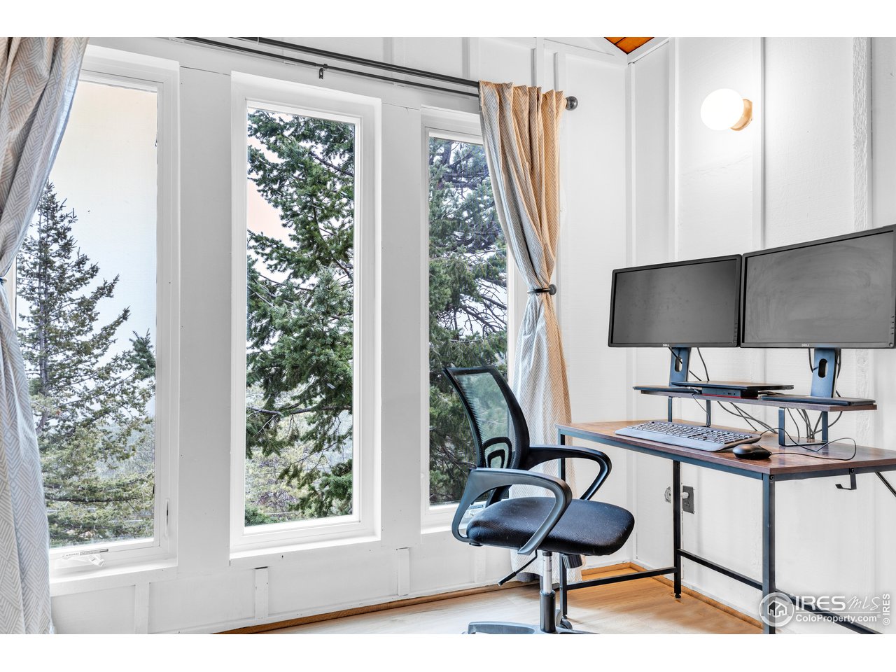 287 Brook Circle Boulder, CO 80302 - Photo 18 of 36 a living room with furniture and a floor to ceiling window