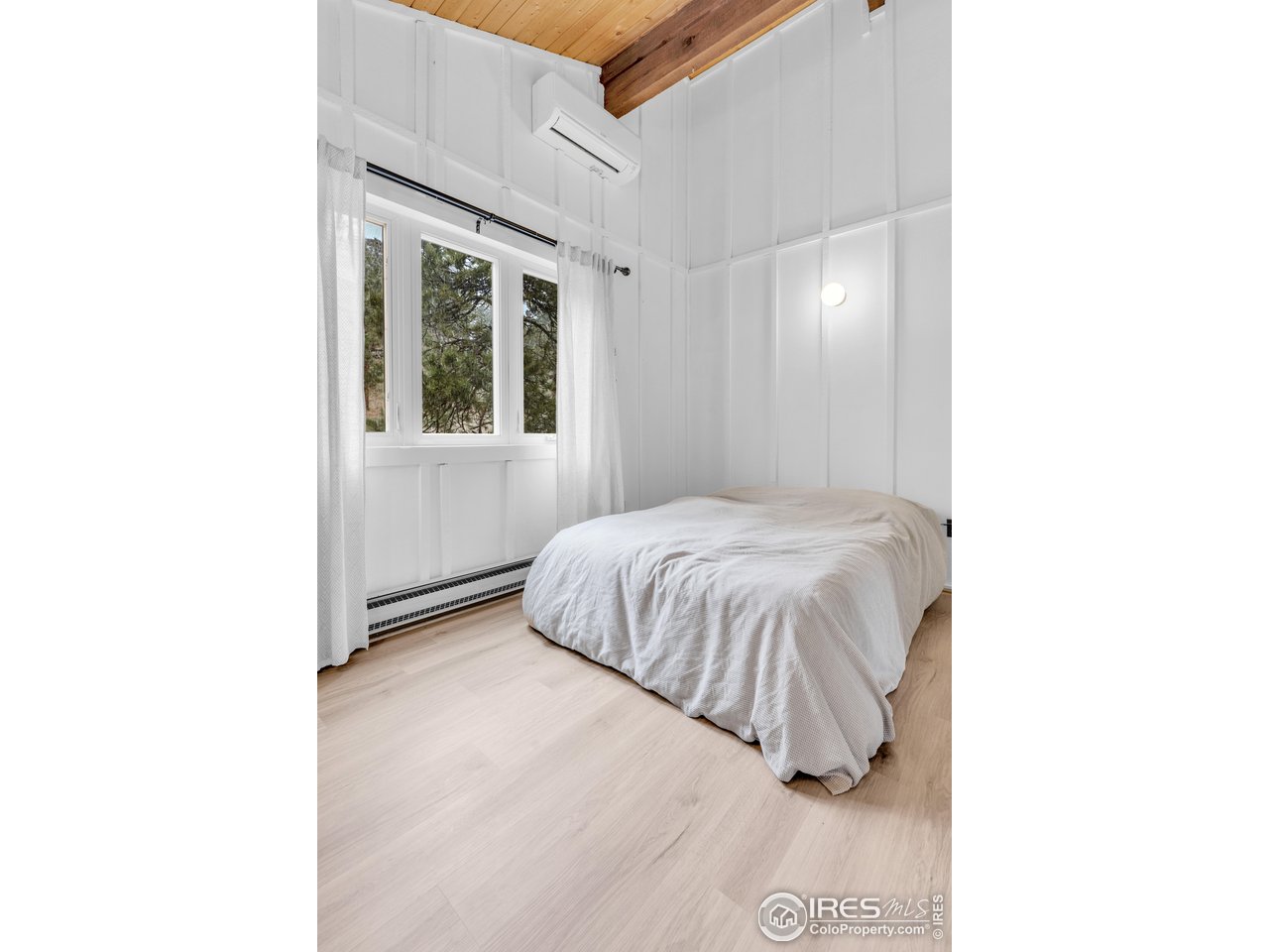 287 Brook Circle Boulder, CO 80302 - Photo 21 of 36 a bedroom with a bed and a window