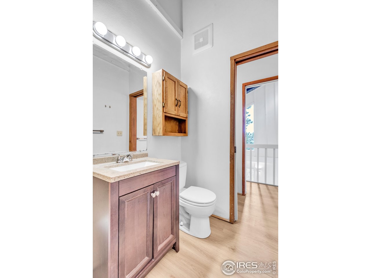 287 Brook Circle Boulder, CO 80302 - Photo 22 of 36 a bathroom with a toilet sink and mirror