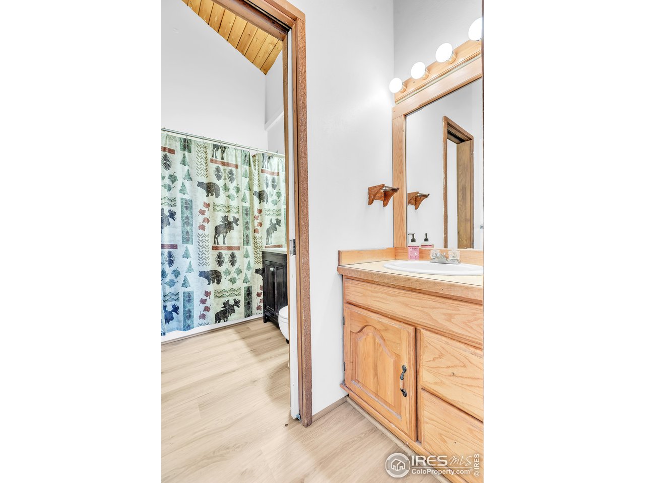 287 Brook Circle Boulder, CO 80302 - Photo 23 of 36 a bathroom with a sink and a mirror