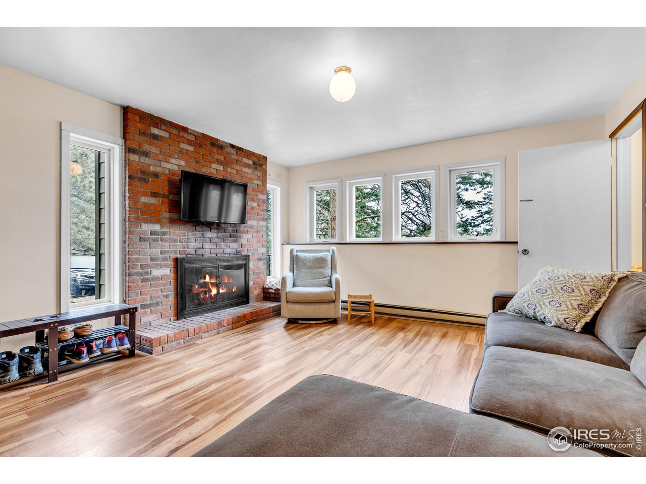 287 Brook Circle Boulder, CO 80302 - Photo 26 of 36 a living room with furniture and a fireplace