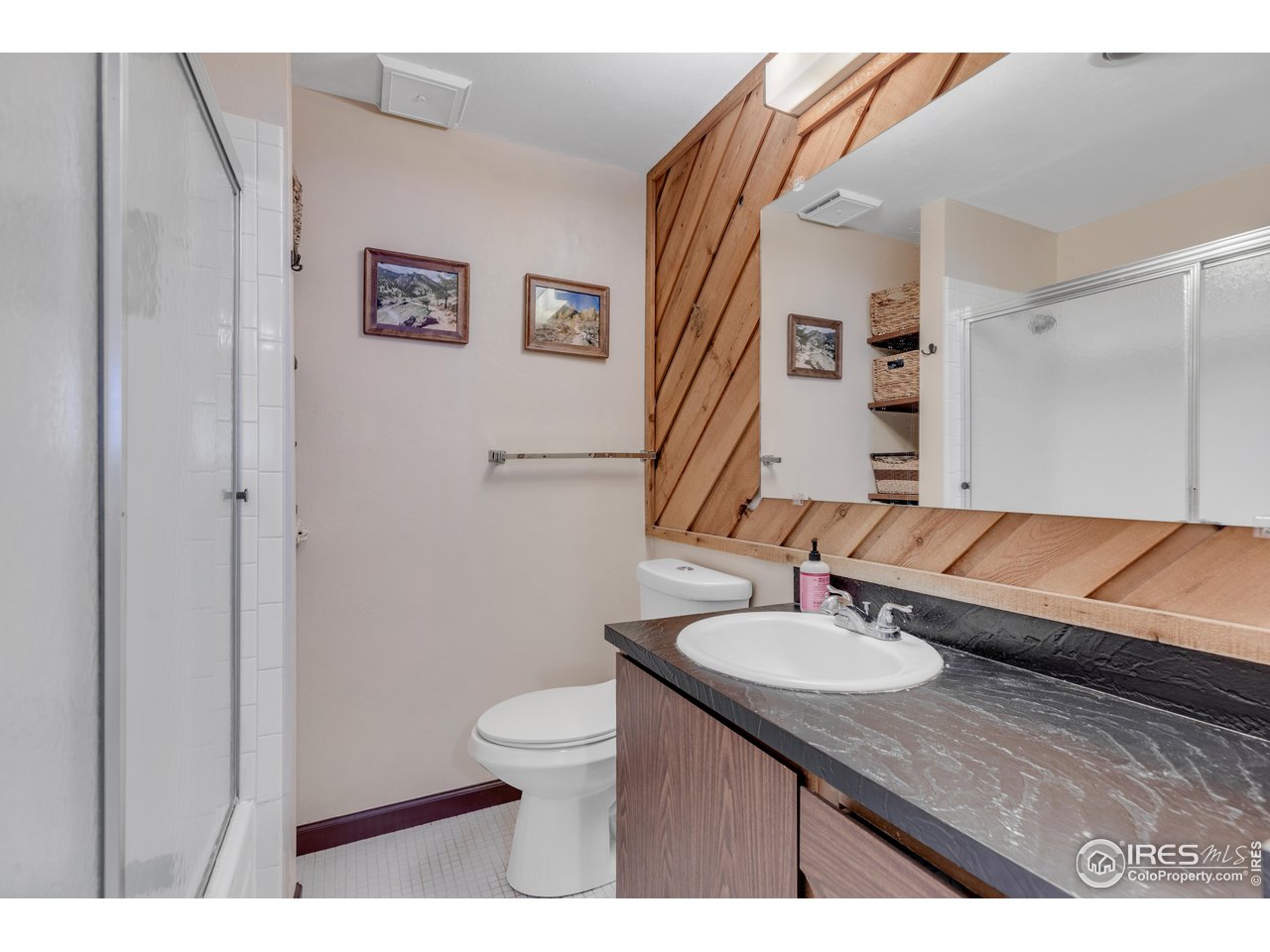 287 Brook Circle Boulder, CO 80302 - Photo 30 of 36 a bathroom with a sink a toilet and mirror