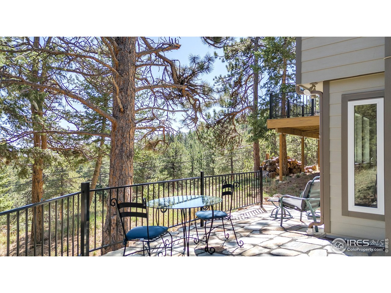 287 Brook Circle Boulder, CO 80302 - Photo 31 of 36 a view of a balcony with floor to ceiling window and wooden fence