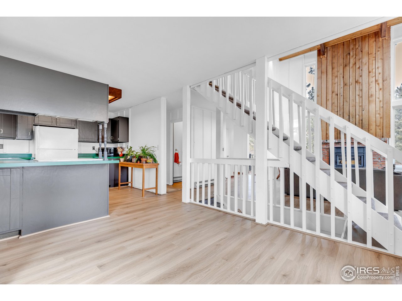 287 Brook Circle Boulder, CO 80302 - Photo 9 of 36 a view interior of kitchen and hall with wooden floor