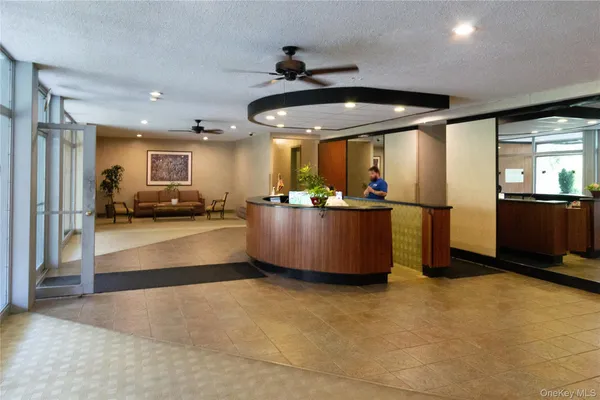 a view of a living room and kitchen