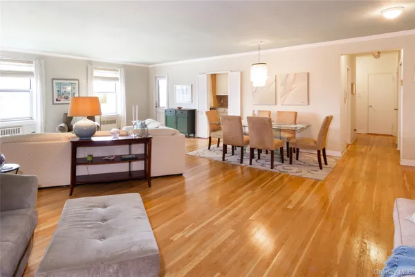 a view of a dining room with furniture and wooden floor