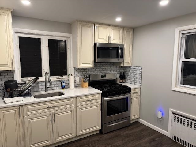 531 Walnut Street, Unit 2 Ridgefield, NJ 07657 - Photo 4 of 9 a kitchen with a sink stove and microwave