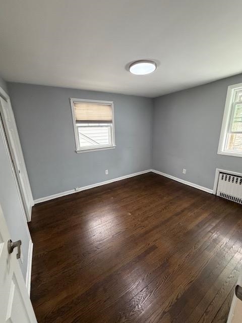 531 Walnut Street, Unit 2 Ridgefield, NJ 07657 - Photo 8 of 9 a view of an empty room with wooden floor and a window