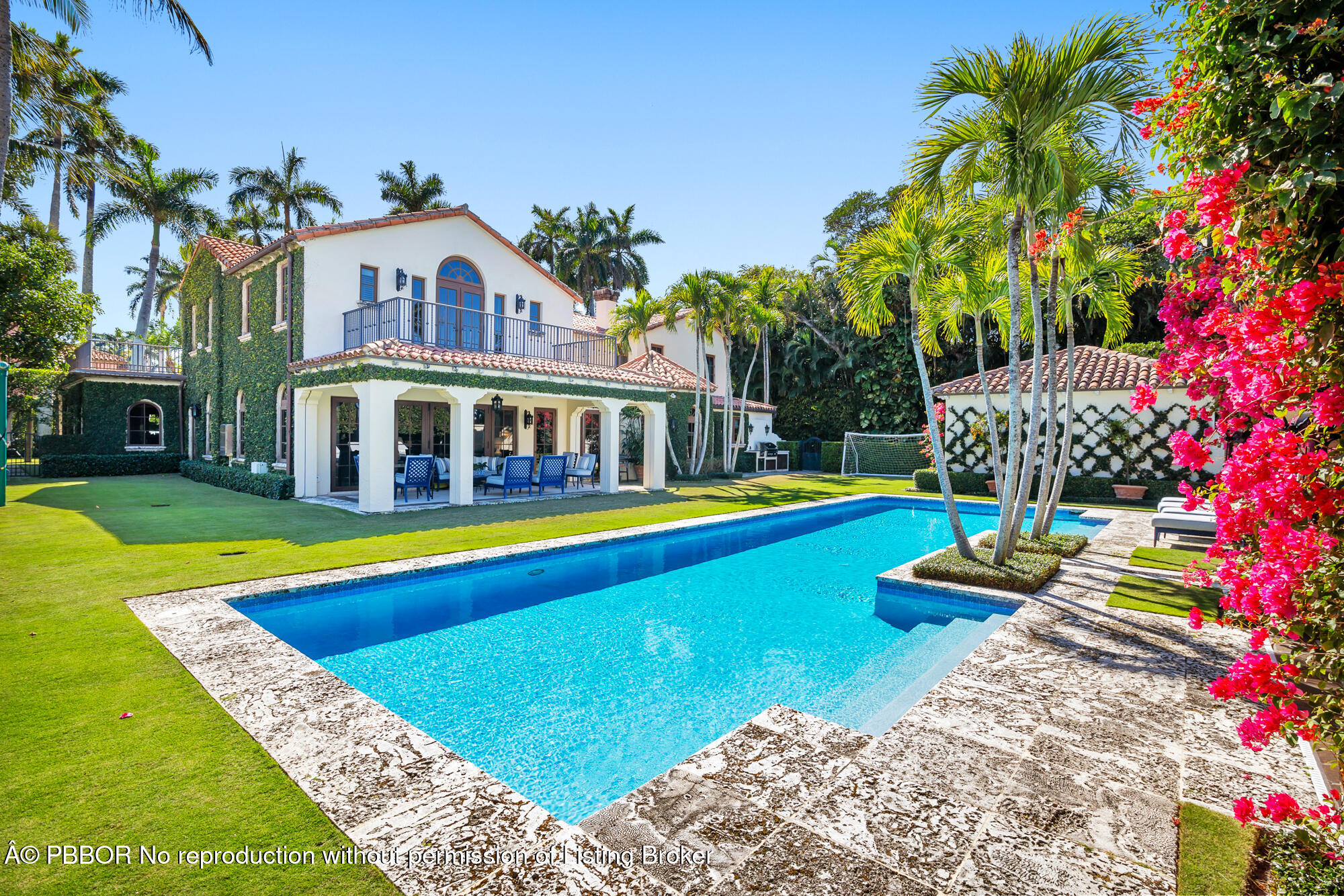 237 El Bravo Way Palm Beach, FL 33480 - Photo 1 of 41 a view of a swimming pool with lawn chairs and plants