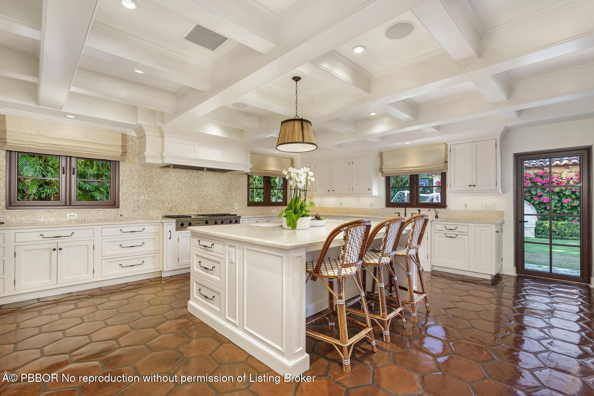 237 El Bravo Way Palm Beach, FL 33480 - Photo 12 of 41 a kitchen with stainless steel appliances a dining table chairs and granite counter tops