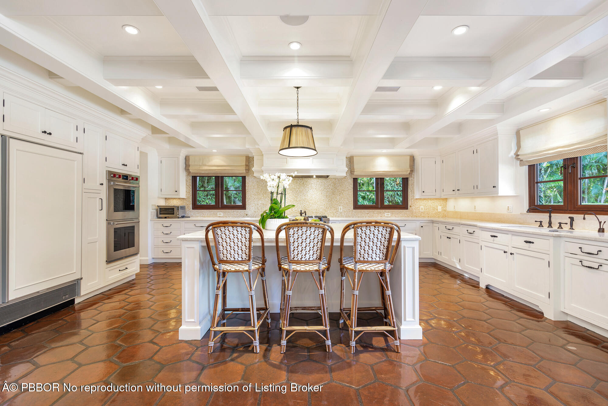 237 El Bravo Way Palm Beach, FL 33480 - Photo 13 of 41 a dining room with furniture and a kitchen view