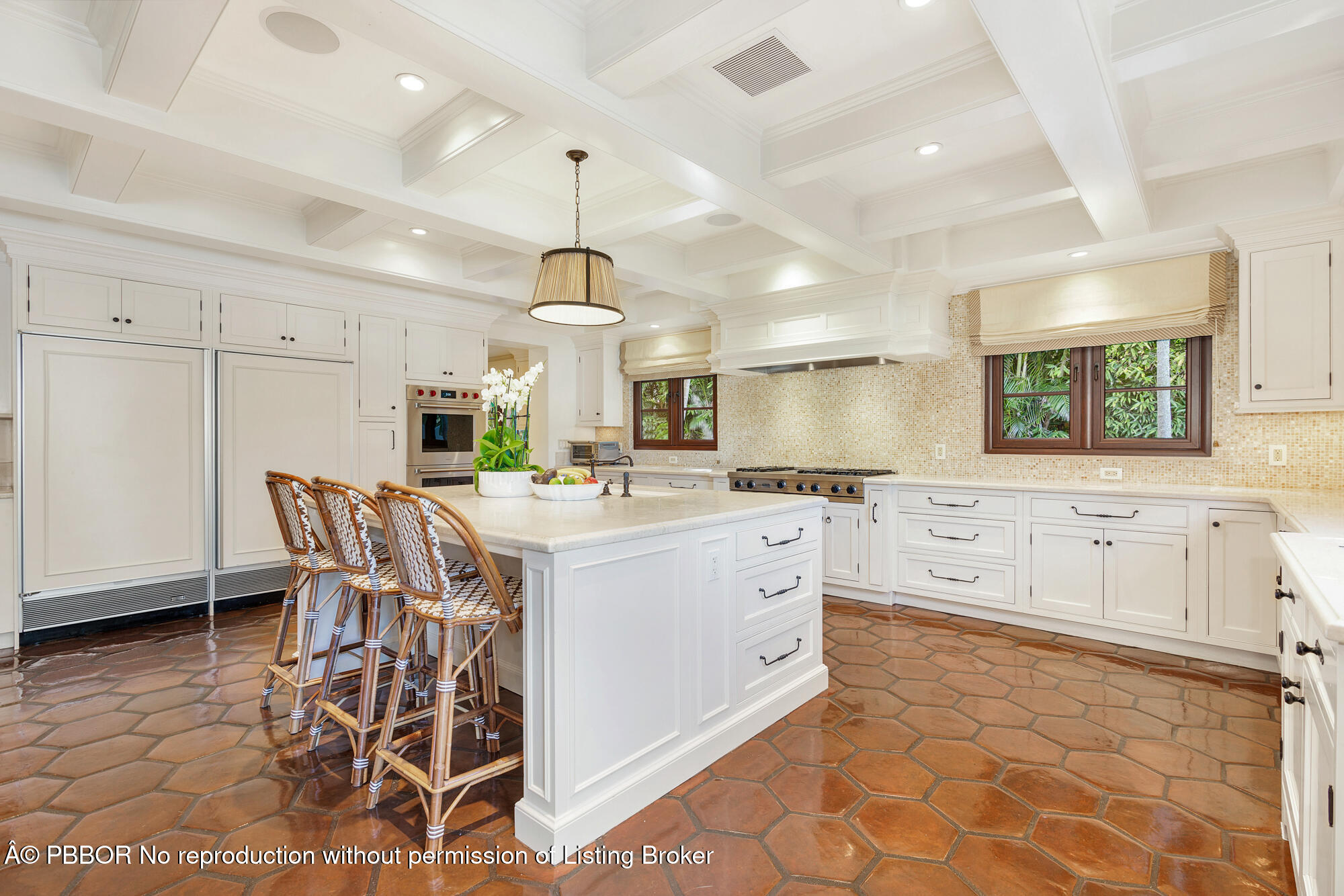 237 El Bravo Way Palm Beach, FL 33480 - Photo 14 of 41 a kitchen with stainless steel appliances kitchen island granite countertop a sink a stove and a refrigerator