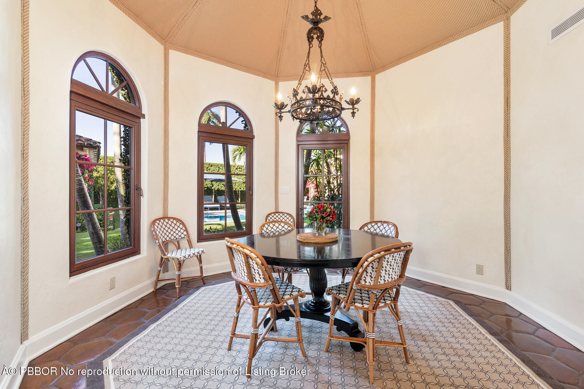 237 El Bravo Way Palm Beach, FL 33480 - Photo 17 of 41 a view of a dining room with furniture window and wooden floor