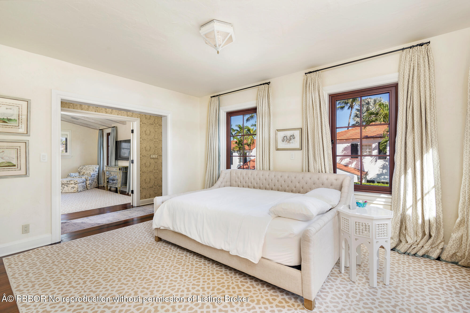 237 El Bravo Way Palm Beach, FL 33480 - Photo 20 of 41 a bedroom with a large bed and a large window
