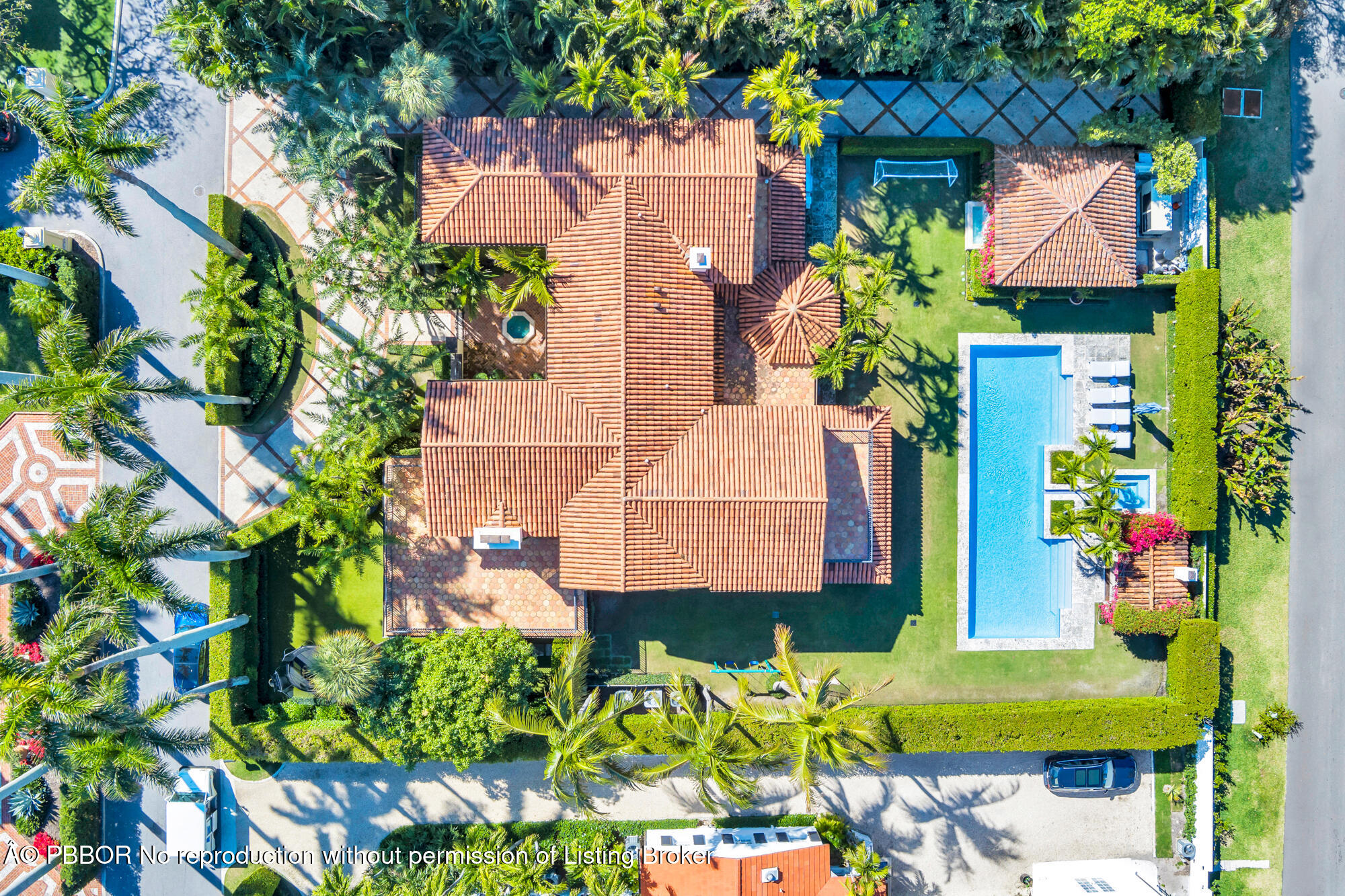 237 El Bravo Way Palm Beach, FL 33480 - Photo 2 of 41 an aerial view of a house with a yard and potted plants