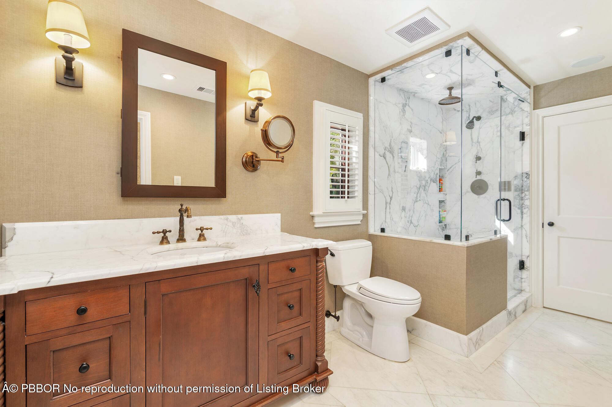 237 El Bravo Way Palm Beach, FL 33480 - Photo 21 of 41 a bathroom with a toilet sink and mirror