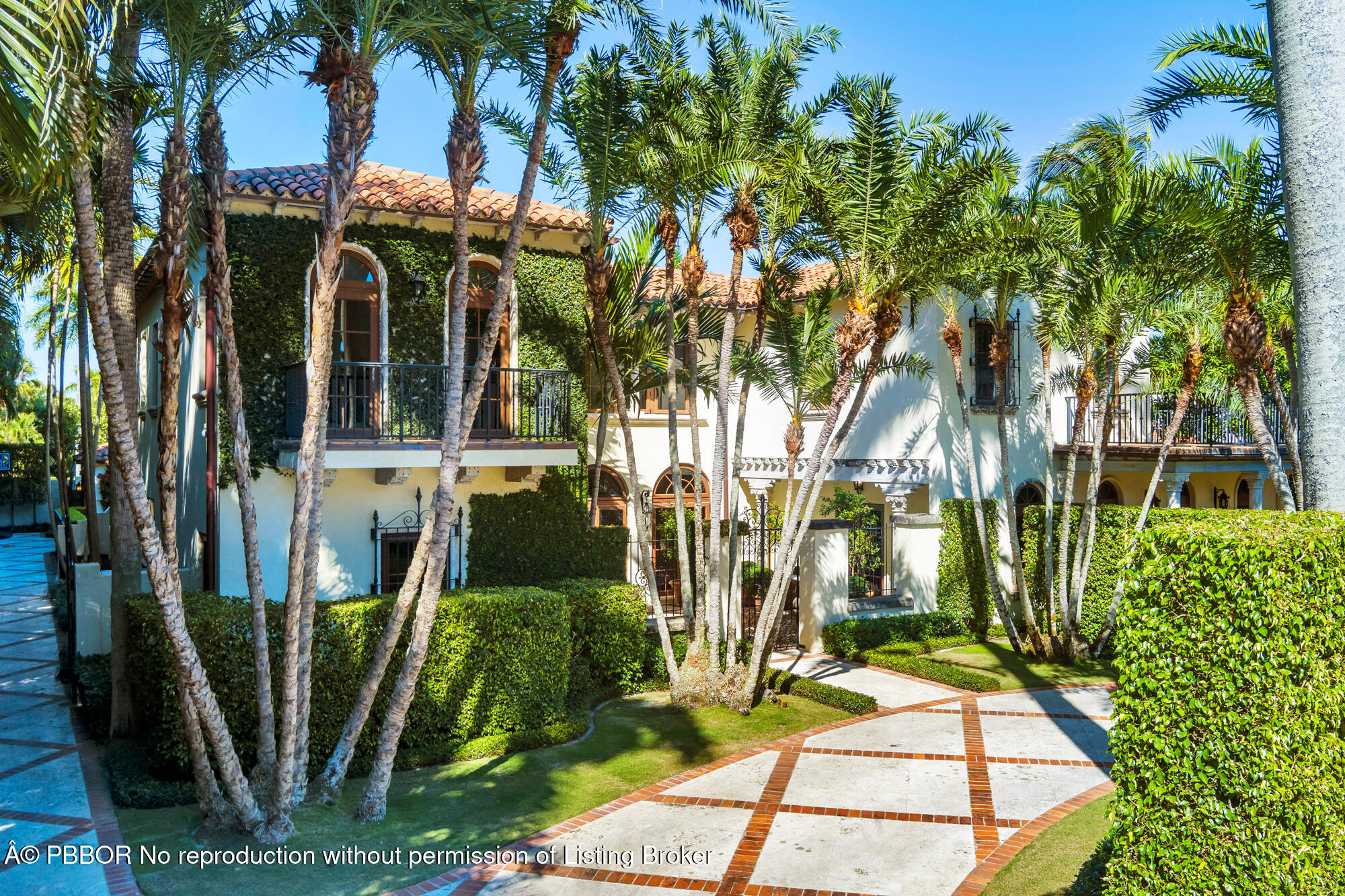 237 El Bravo Way Palm Beach, FL 33480 - Photo 33 of 41 a view of a house with a yard