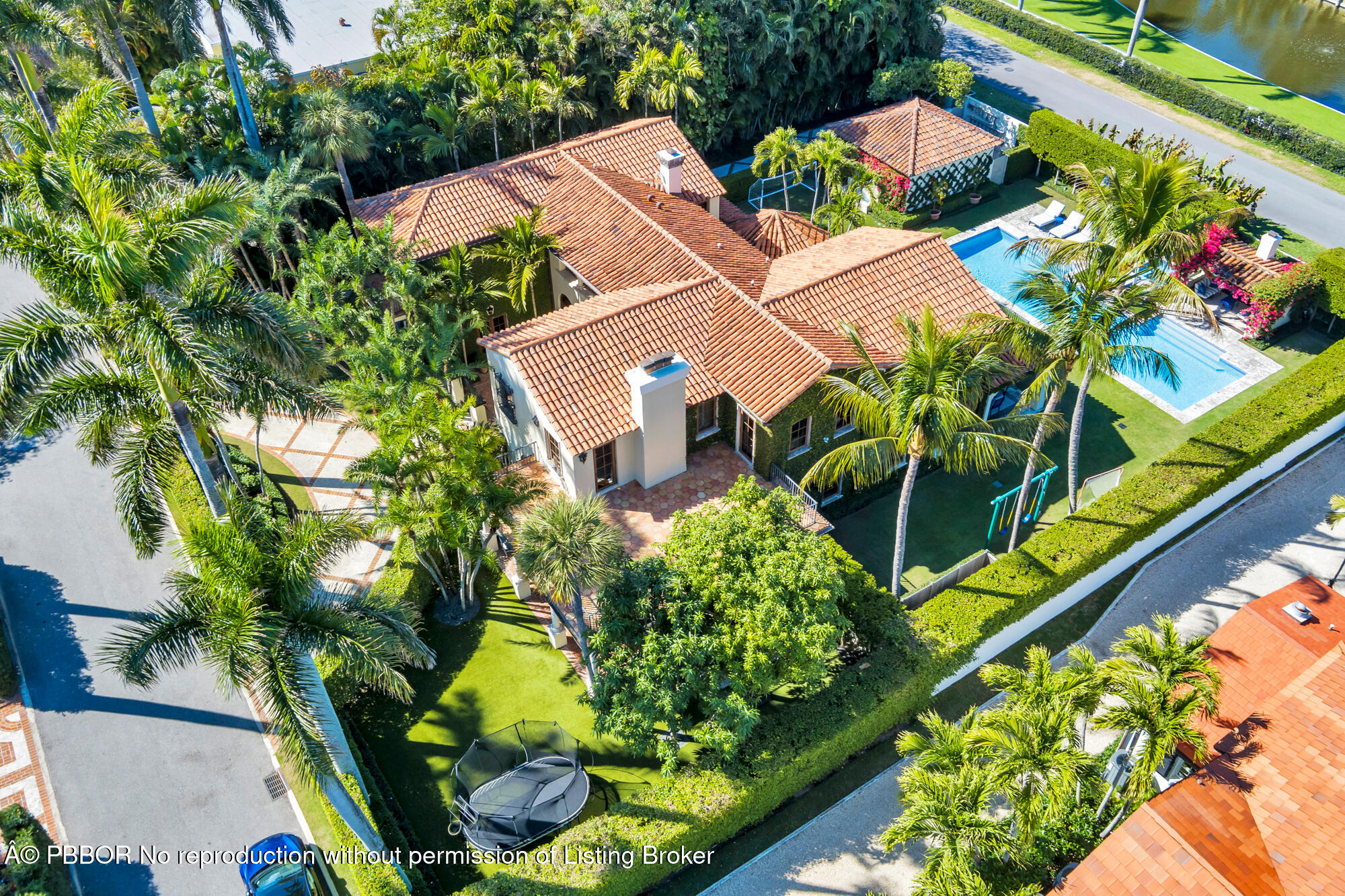237 El Bravo Way Palm Beach, FL 33480 - Photo 36 of 41 an aerial view of a house with a yard and garden