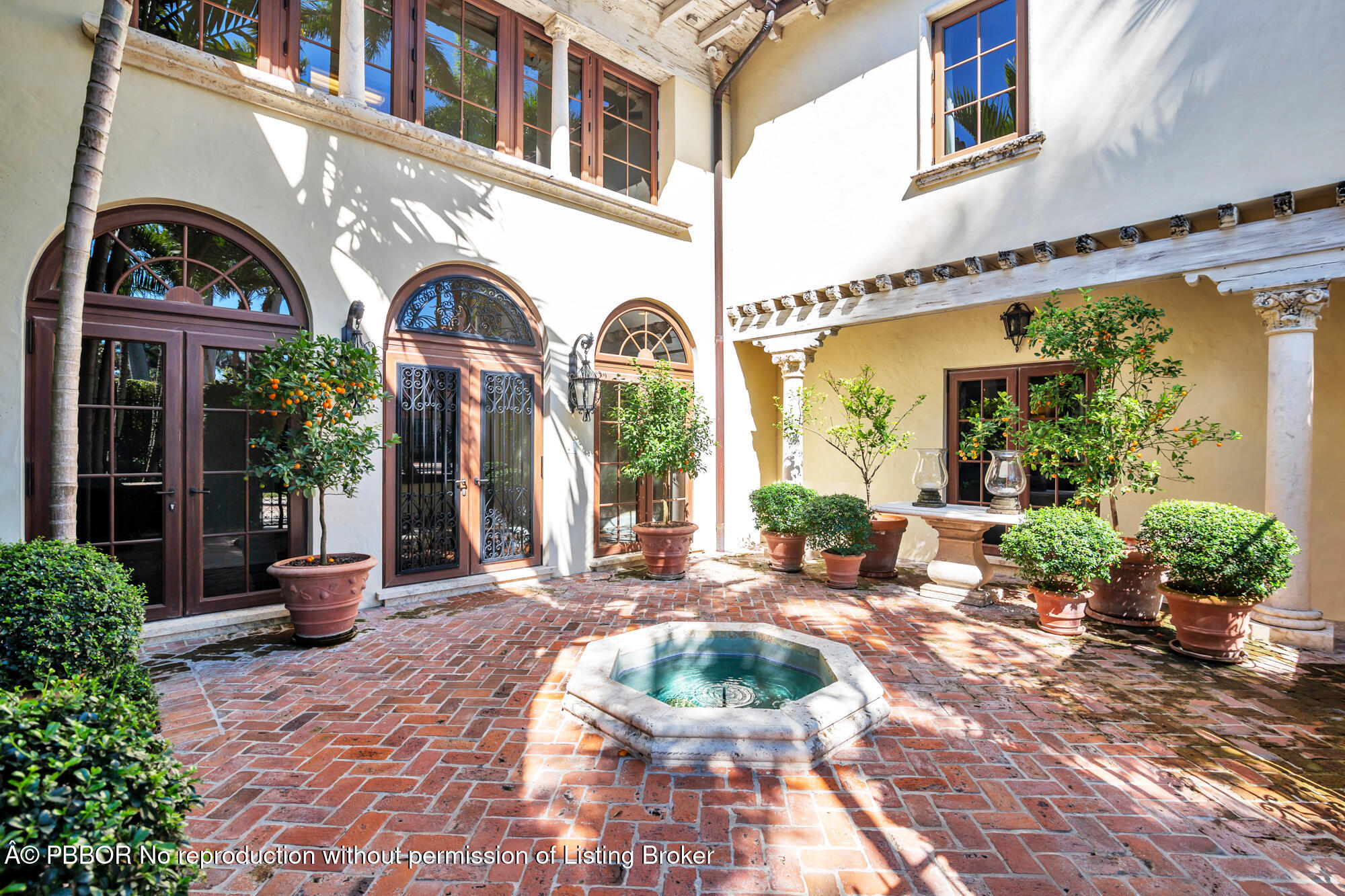237 El Bravo Way Palm Beach, FL 33480 - Photo 5 of 41 a view of a building with potted plants