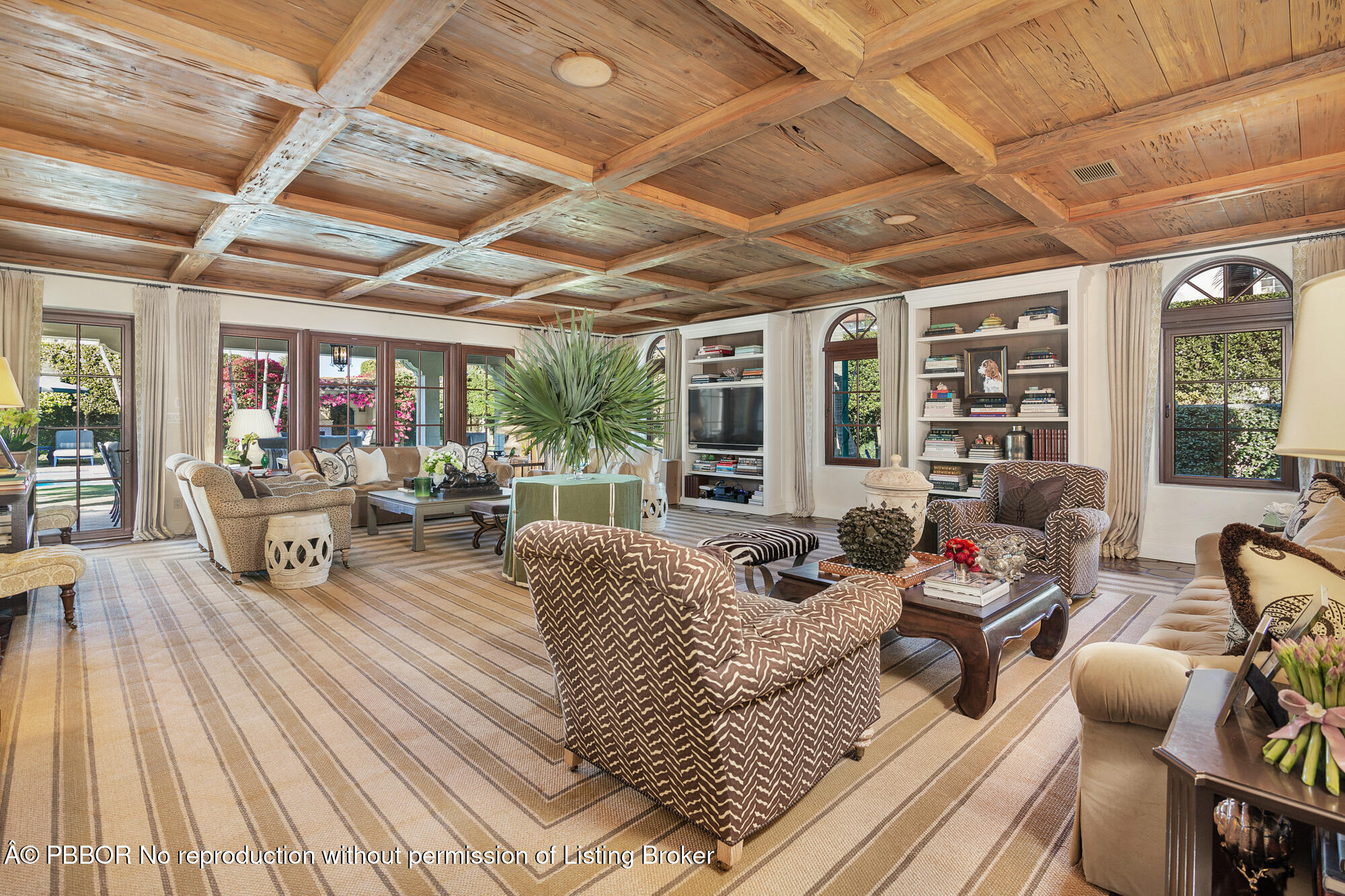 237 El Bravo Way Palm Beach, FL 33480 - Photo 7 of 41 a living room with furniture and a large window