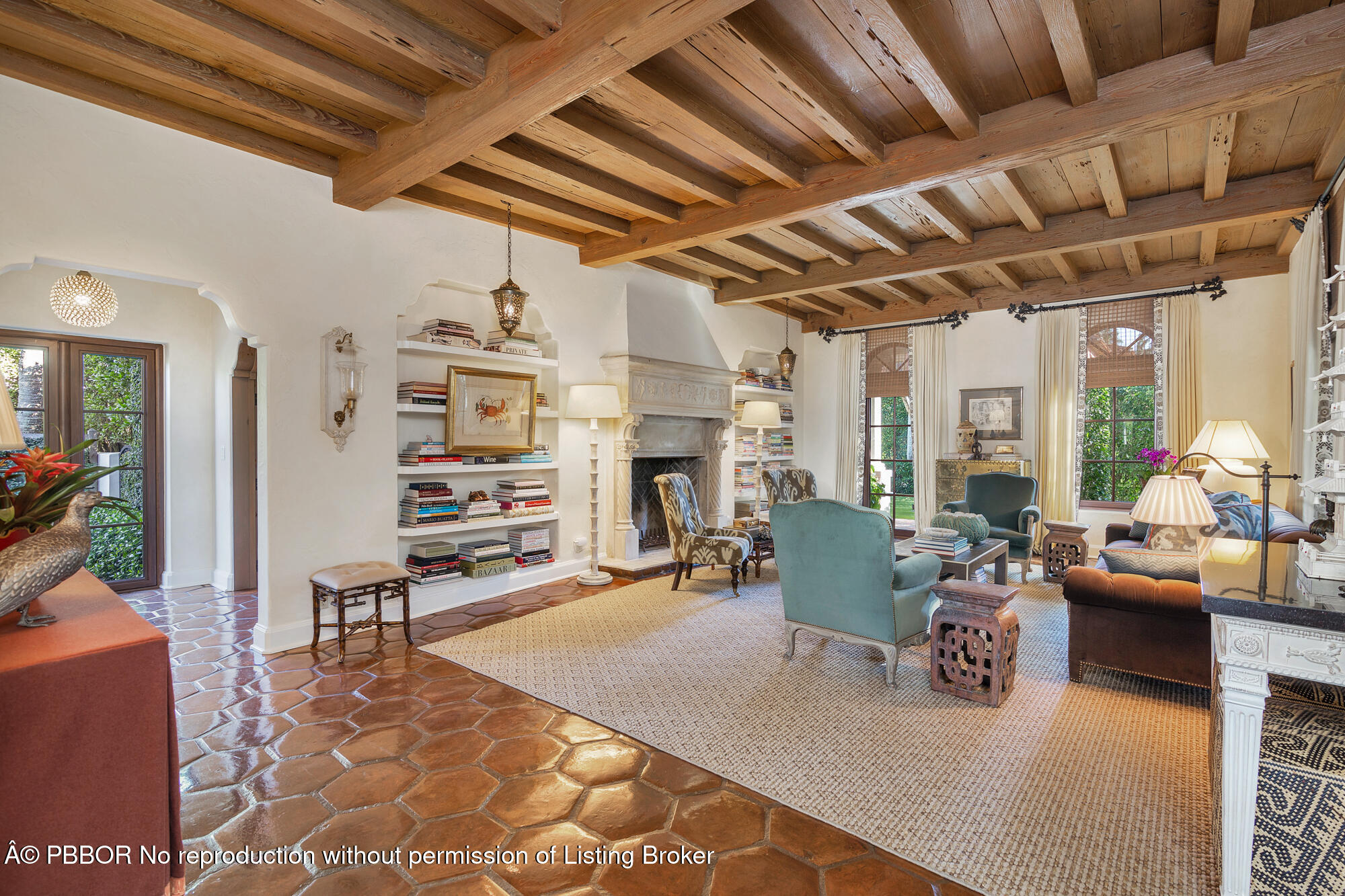 237 El Bravo Way Palm Beach, FL 33480 - Photo 9 of 41 a living room with furniture a fireplace and a table