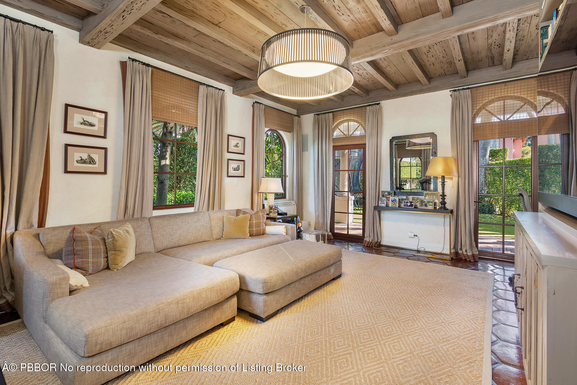 237 El Bravo Way Palm Beach, FL 33480 - Photo 10 of 41 a living room with furniture and a large window