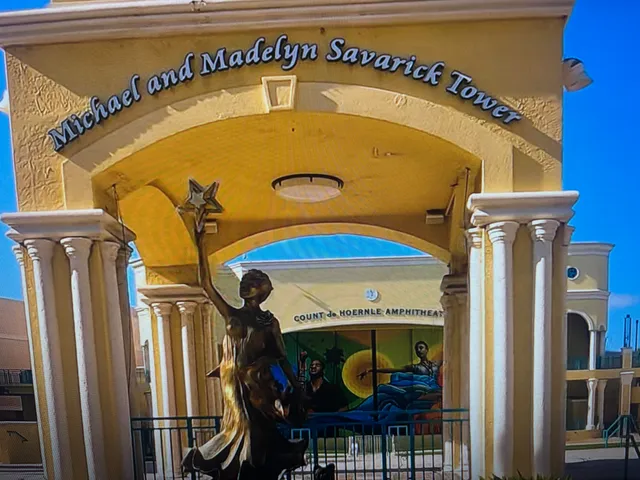 a blue sign that is on the wall of a building