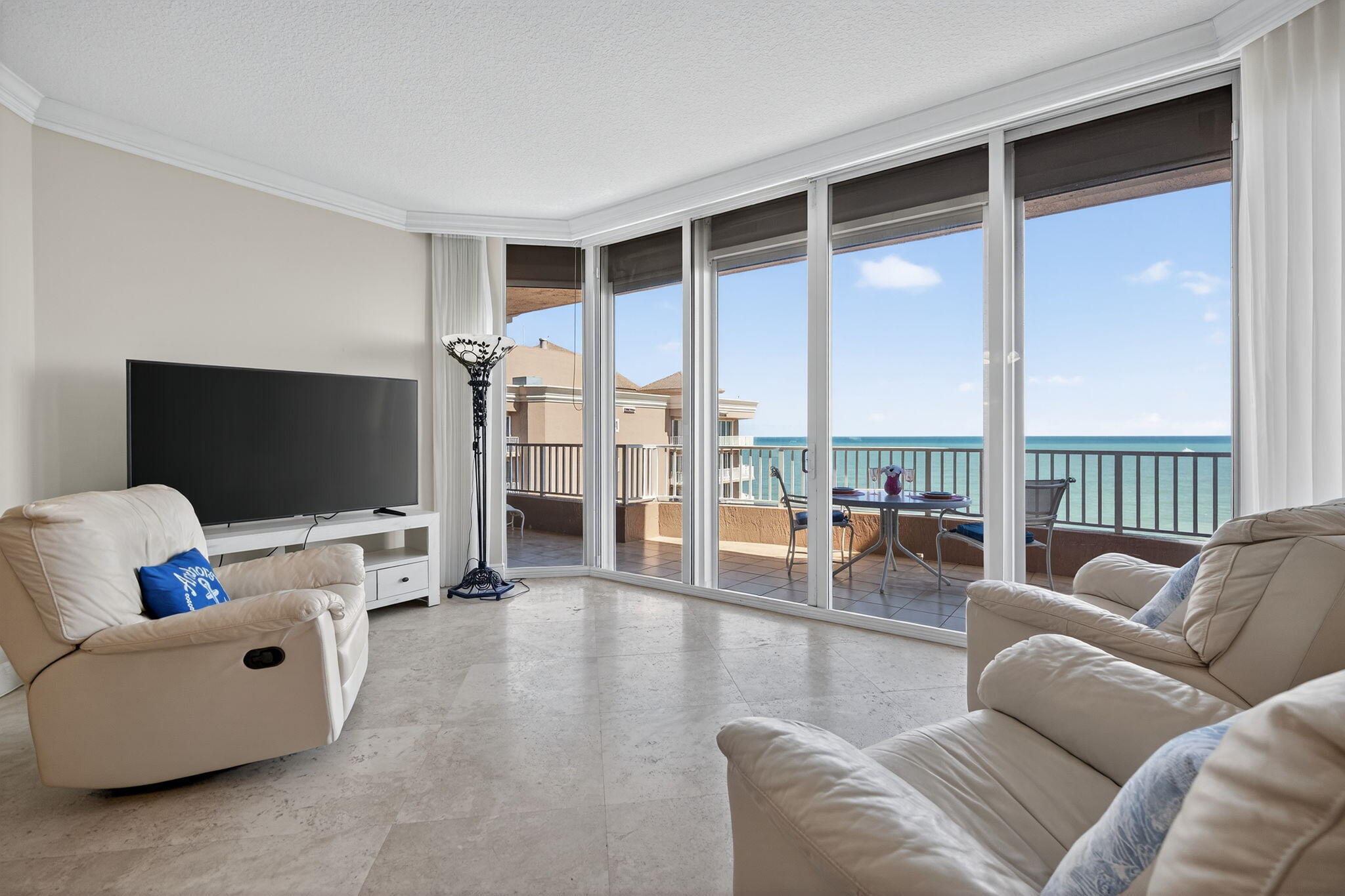 700 Ocean Royale, Unit PH 3 Juno Beach, FL 33408 - Photo 15 of 38 a living room with furniture and a flat screen tv