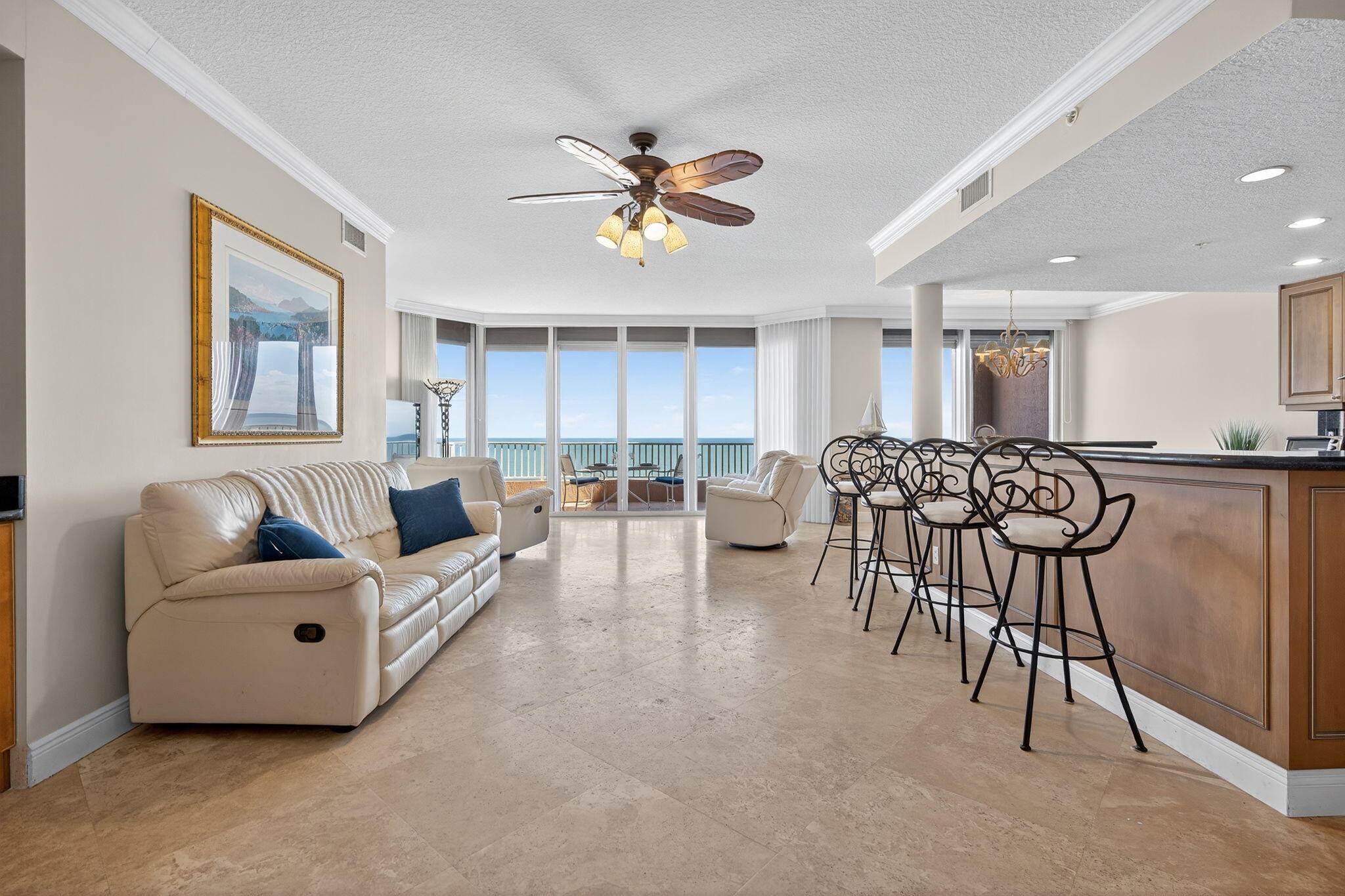700 Ocean Royale, Unit PH 3 Juno Beach, FL 33408 - Photo 2 of 38 a living room with furniture and kitchen view