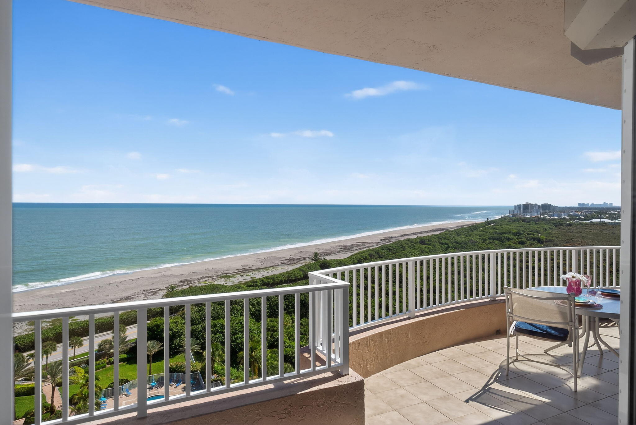 700 Ocean Royale, Unit PH 3 Juno Beach, FL 33408 - Photo 23 of 38 a view of a balcony with wooden floor