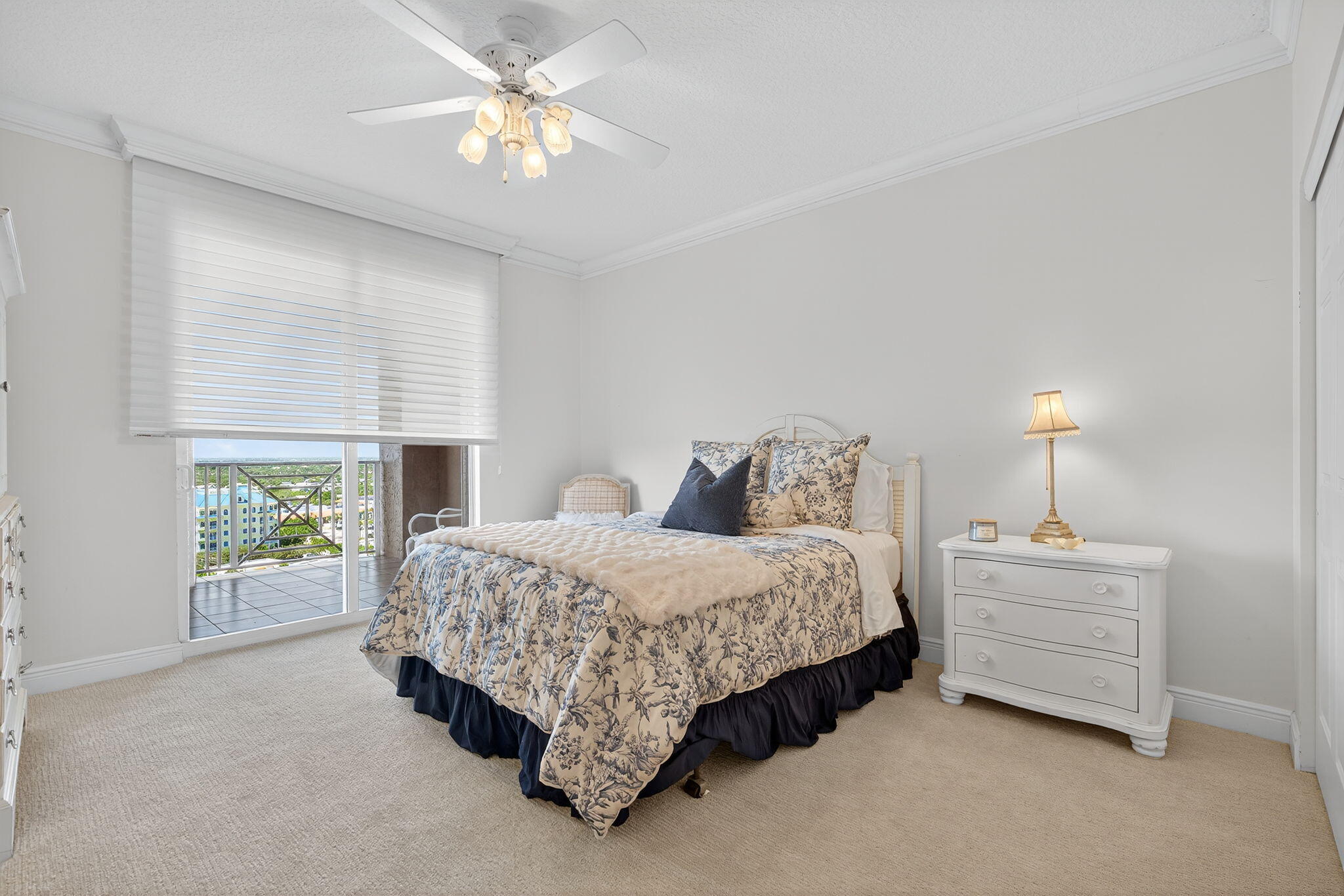 700 Ocean Royale, Unit PH 3 Juno Beach, FL 33408 - Photo 30 of 38 a bedroom with a bed chandelier and a window