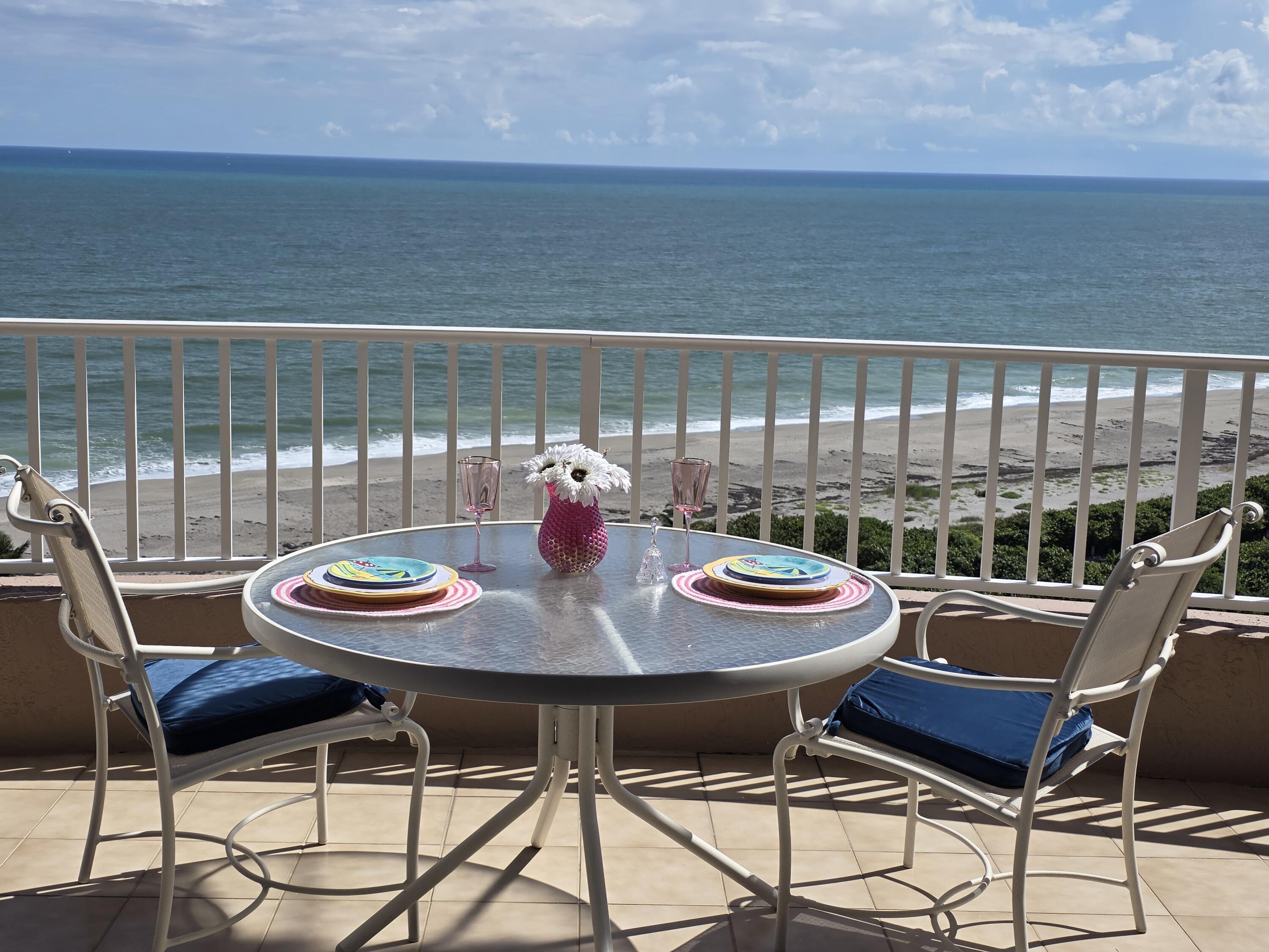 700 Ocean Royale, Unit PH 3 Juno Beach, FL 33408 - Photo 3 of 38 a view of a dining room with furniture and wooden floor