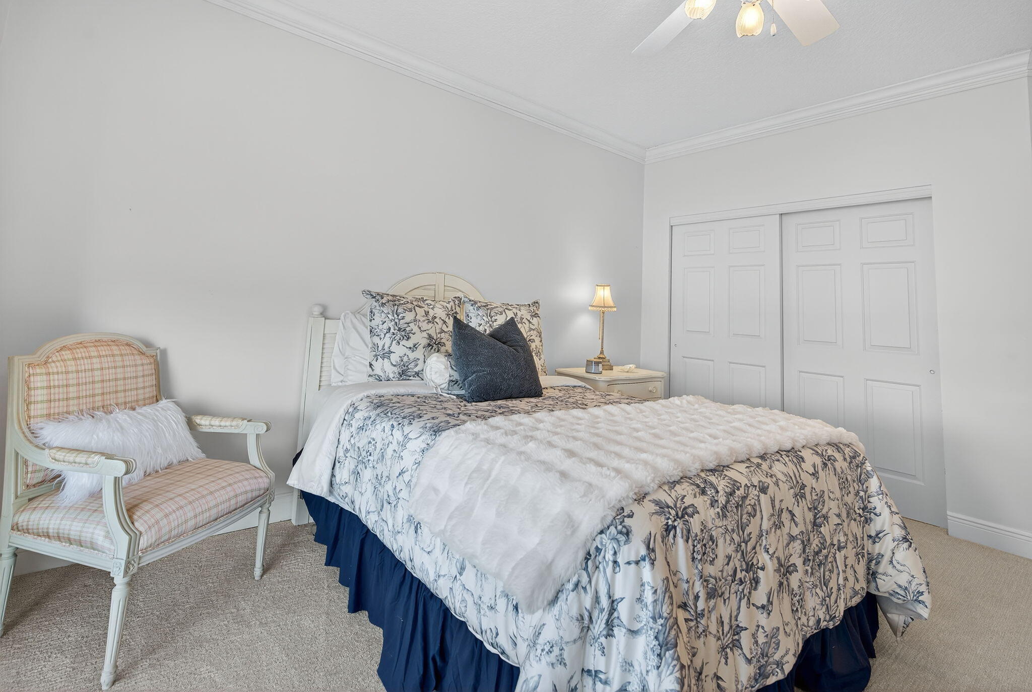 700 Ocean Royale, Unit PH 3 Juno Beach, FL 33408 - Photo 31 of 38 a bedroom with a bed and a chair