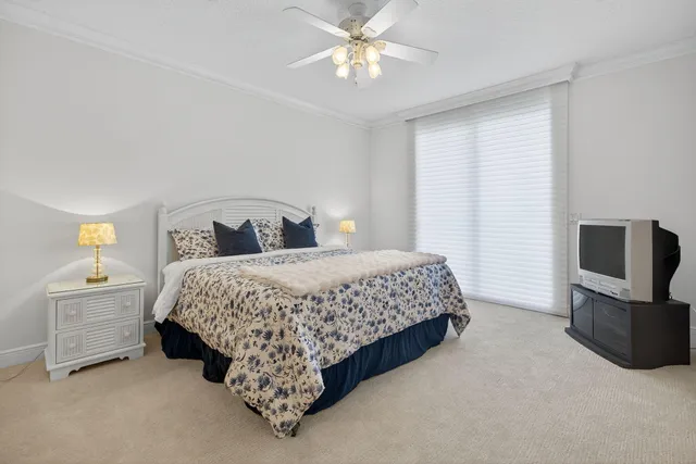 a bedroom with a bed and a television