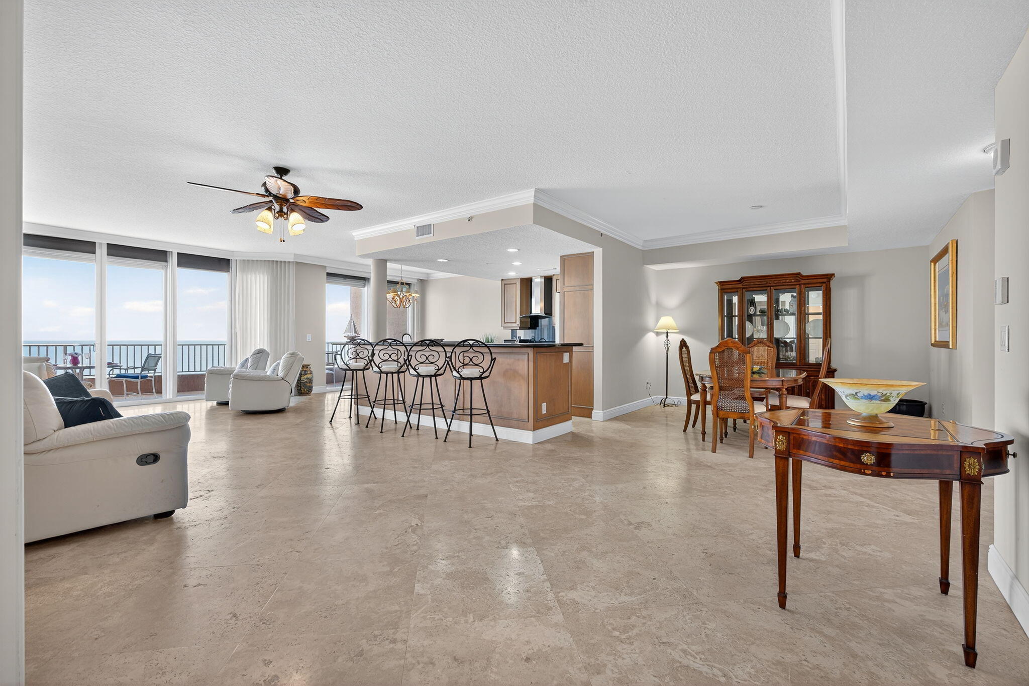 700 Ocean Royale, Unit PH 3 Juno Beach, FL 33408 - Photo 4 of 38 a living room with furniture and a table