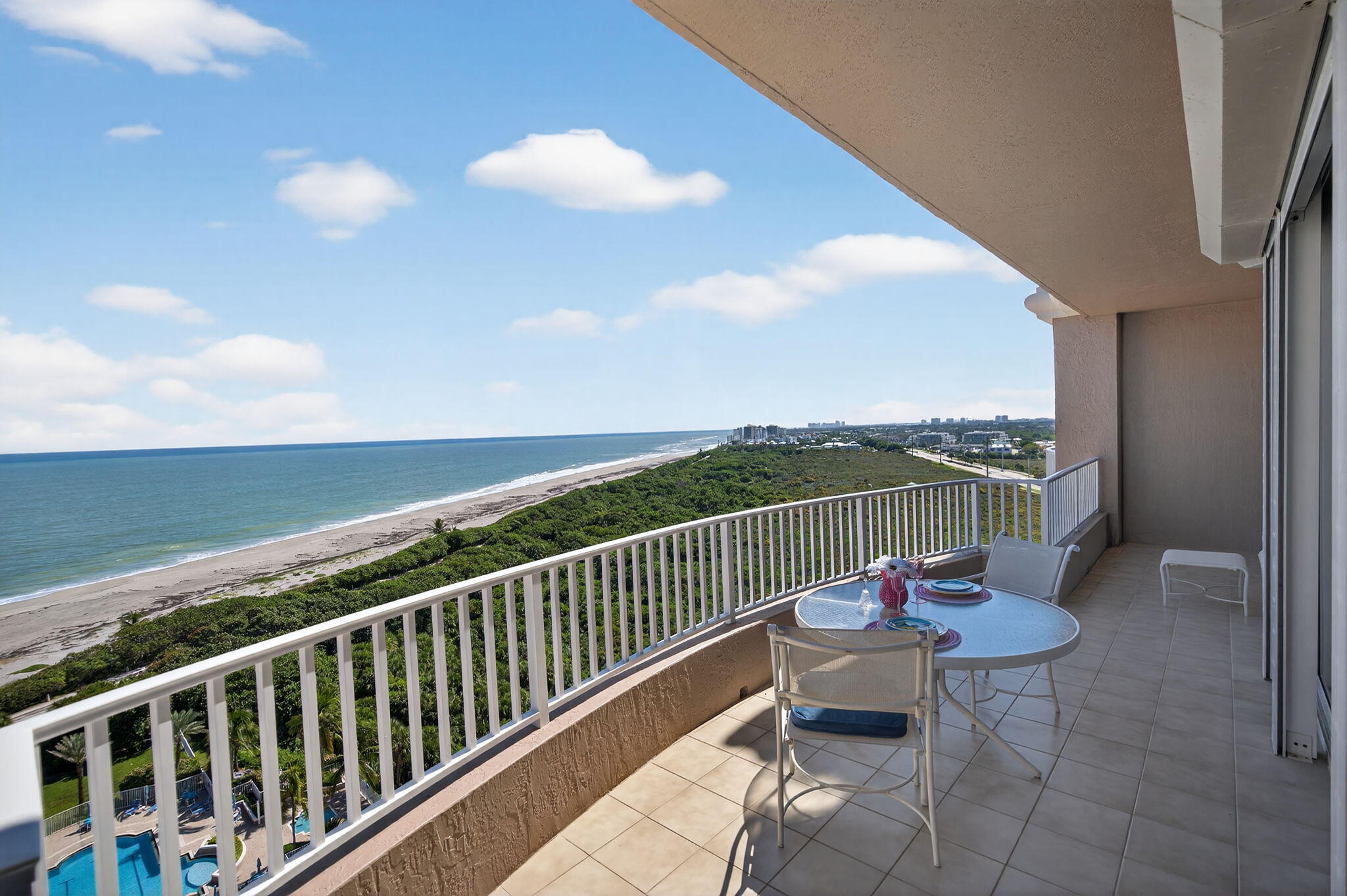700 Ocean Royale, Unit PH 3 Juno Beach, FL 33408 - Photo 8 of 38 a balcony with furniture and city view