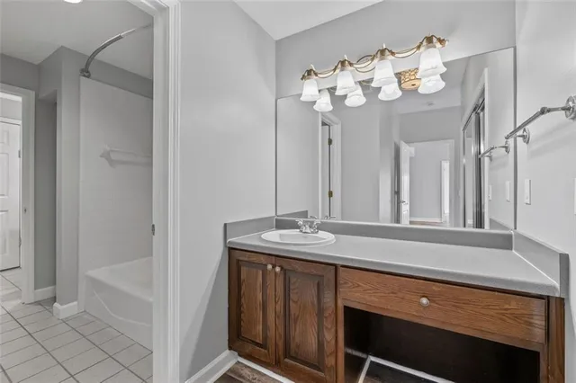 a bathroom with a sink vanity and mirror