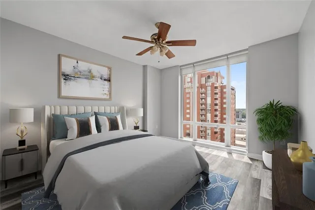 a bed sitting in a bedroom next to a window